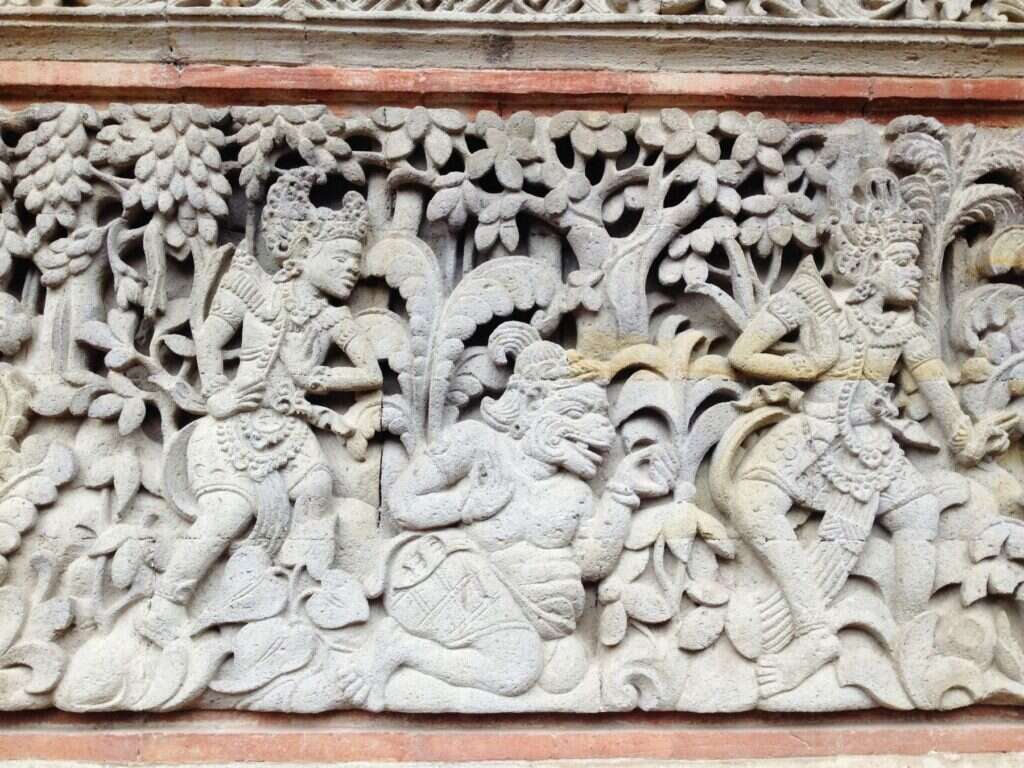 Carved stone wall relief with figures