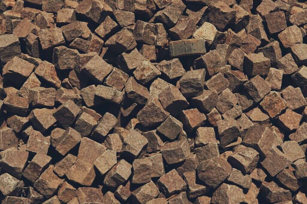 Brown granite cobblestones piled together