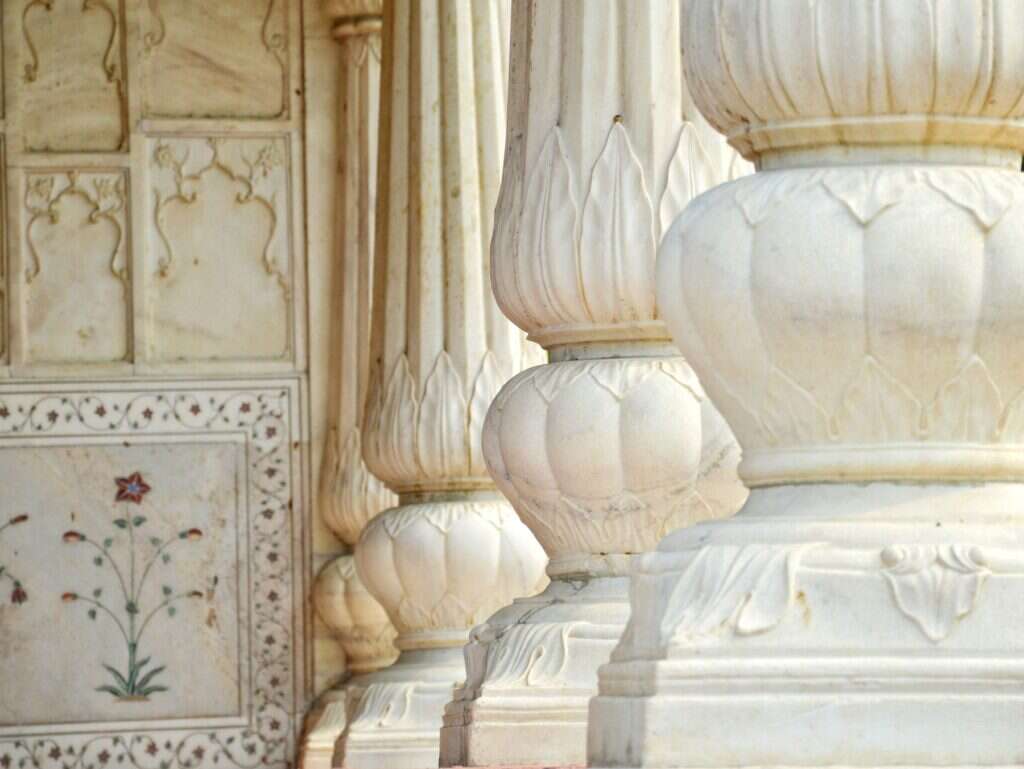 White marble pillars with lotus carving