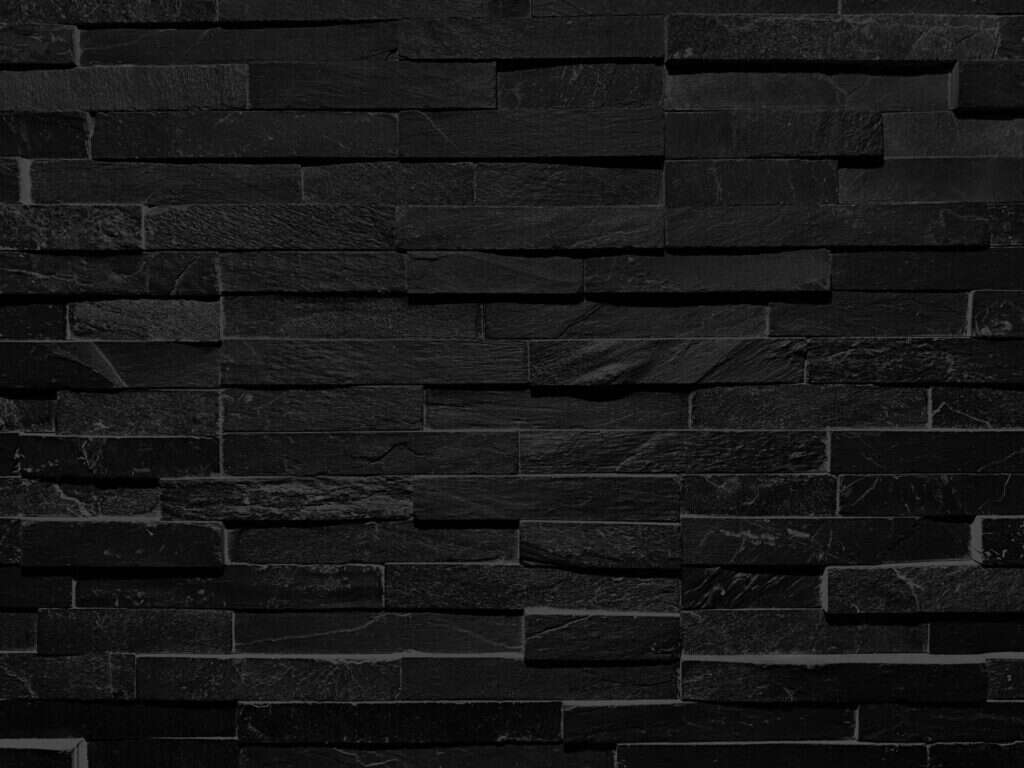 Black slate stone cladding wall close-up
