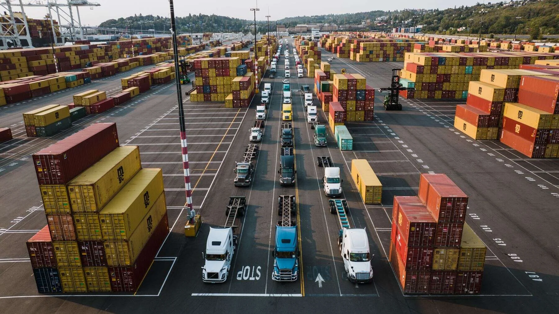 Trucks and containers lined up at a cargo port