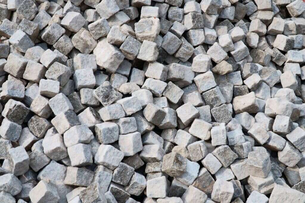 Heap of grey granite cobblestones