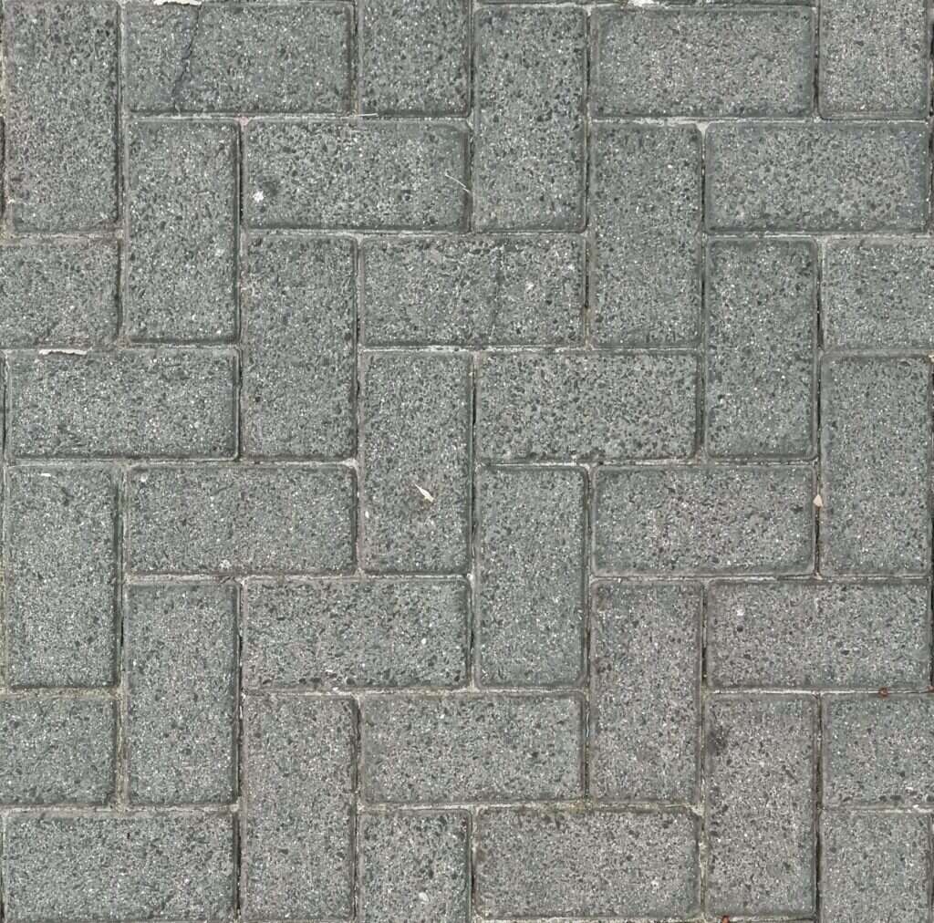 Grey granite pavers laid in a block pattern