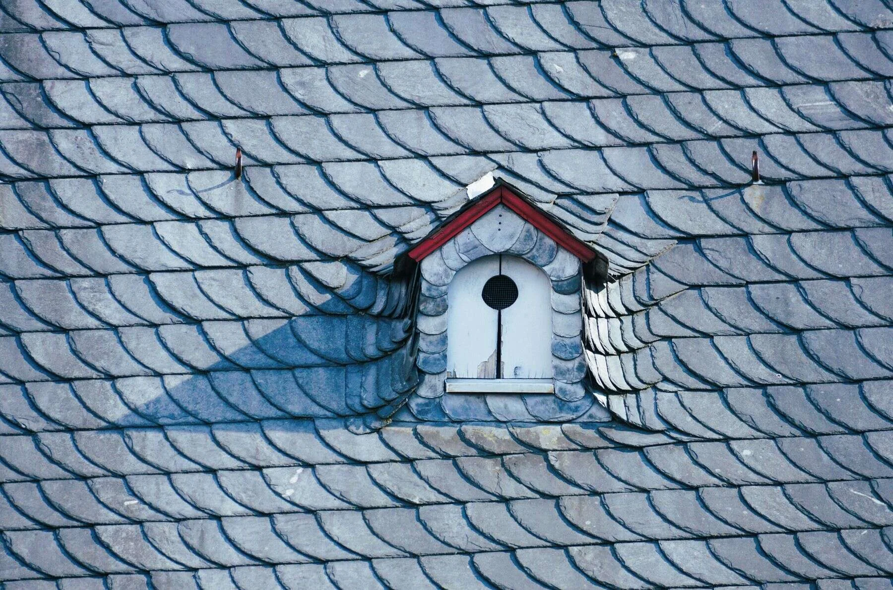 Natural slate roof tiles on a traditional house