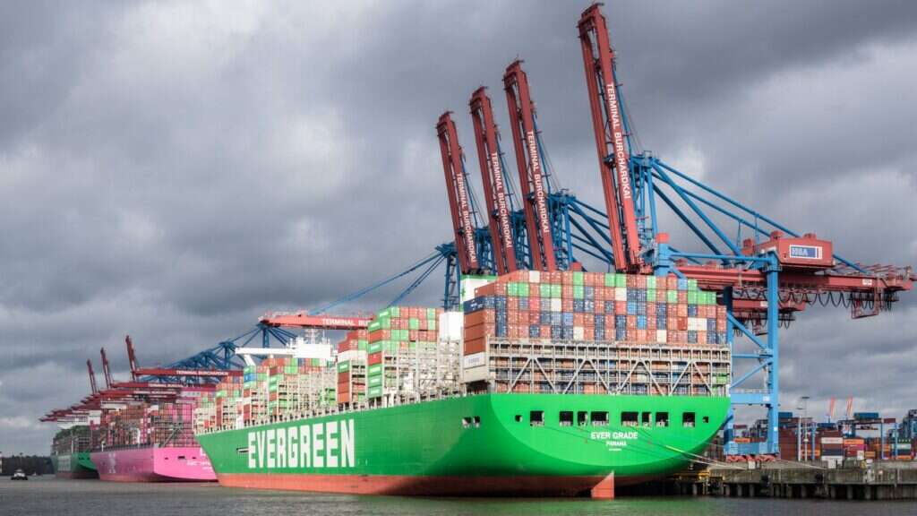 Large container ship loading at a port