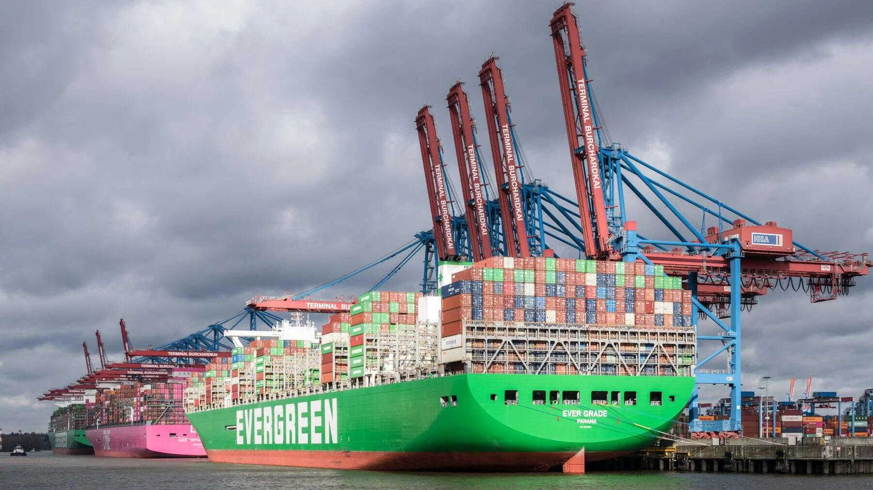 Large container ship loading at a port