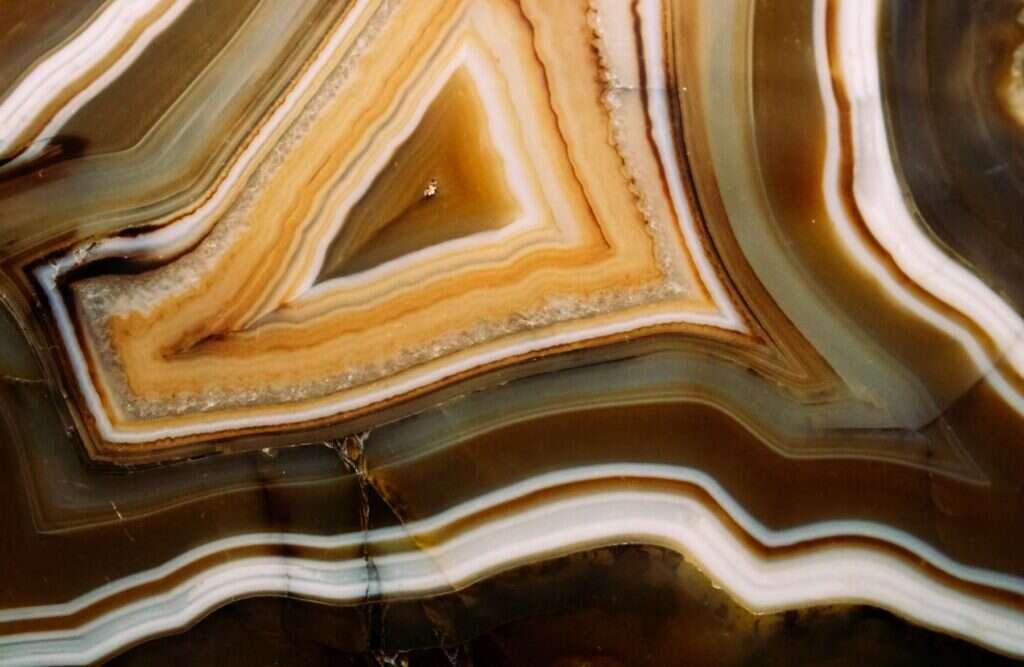 Cross section of banded onyx with orange and white layers
