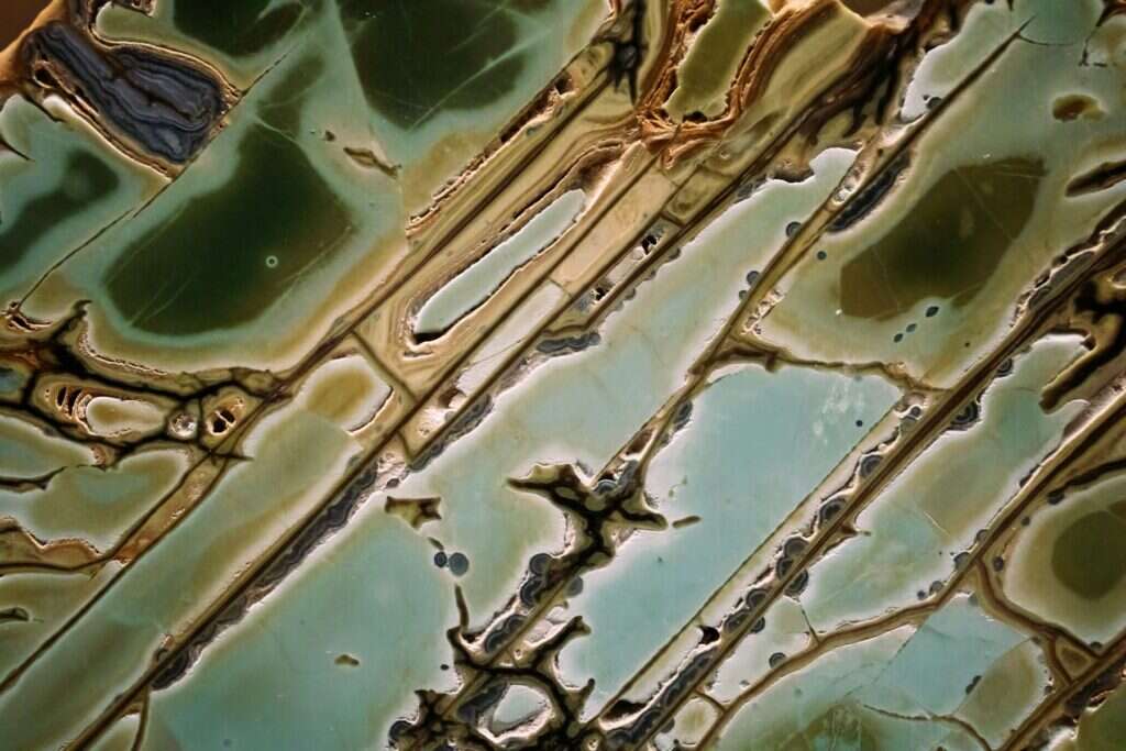 Green translucent onyx stone with dark patches