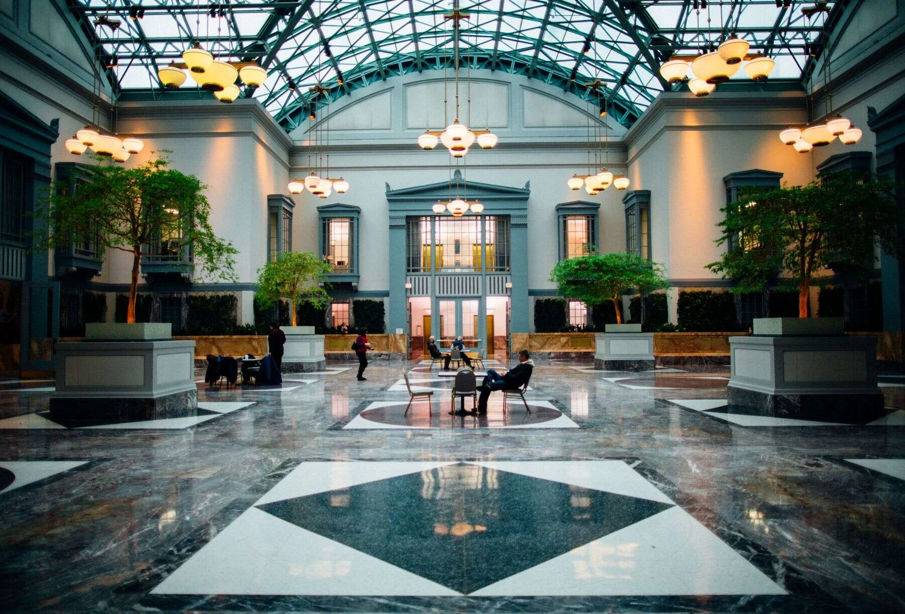Grand hall with a green and white marble floor