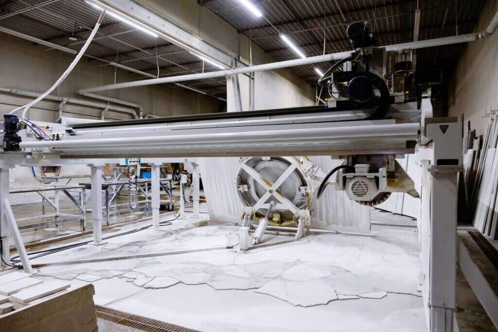 Large stone cutting machine inside a processing plant