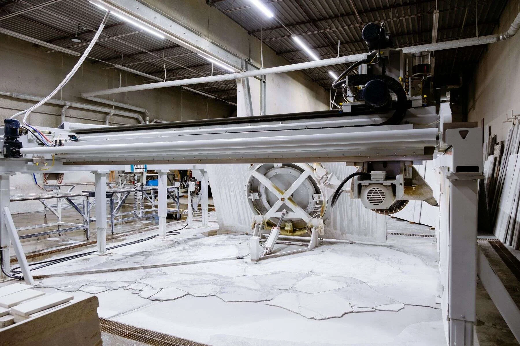 Large stone cutting machine inside a processing plant