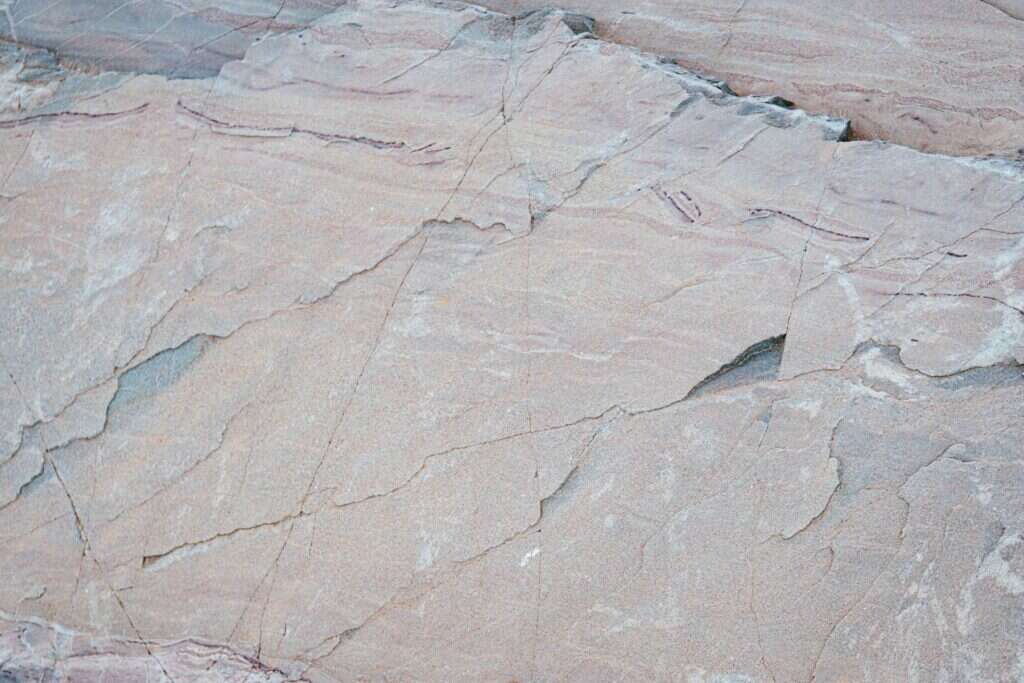 Natural stone surface with pink and grey tones