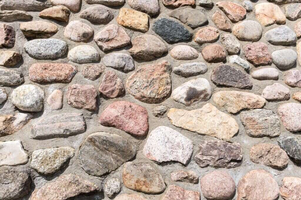 Round fieldstone wall in many natural colours