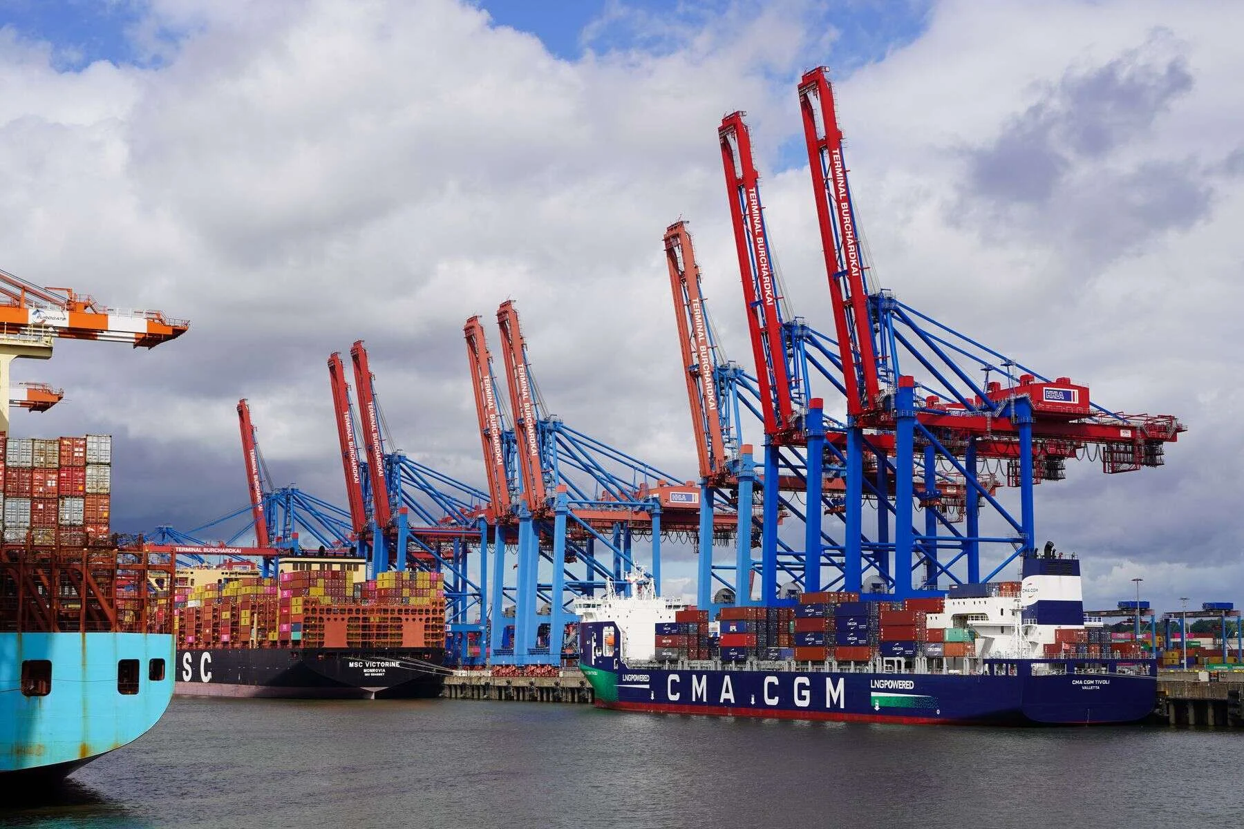 Container ships and cranes at a busy port