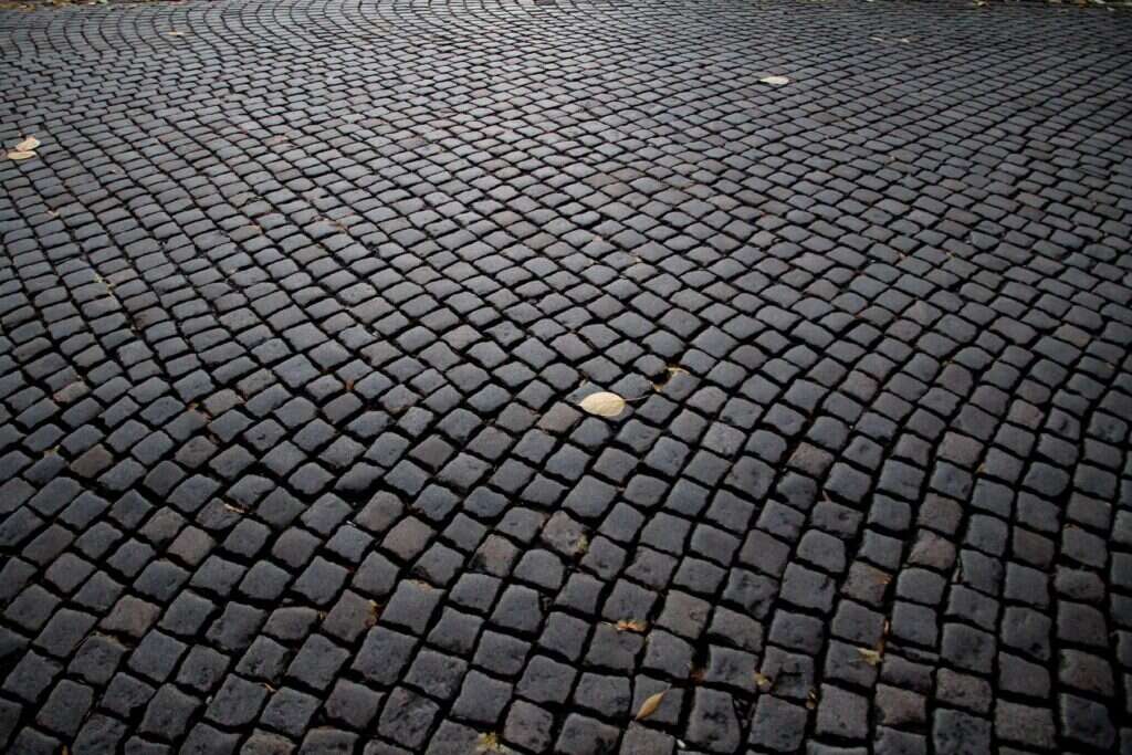 Dark cobblestone street texture