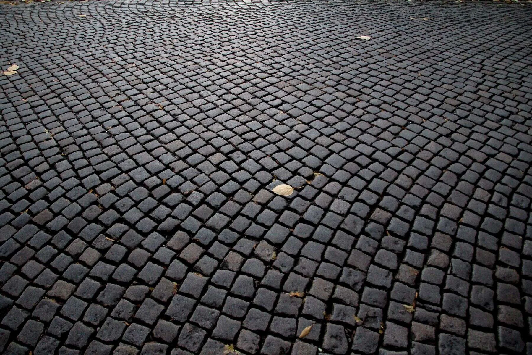 Dark cobblestone street texture