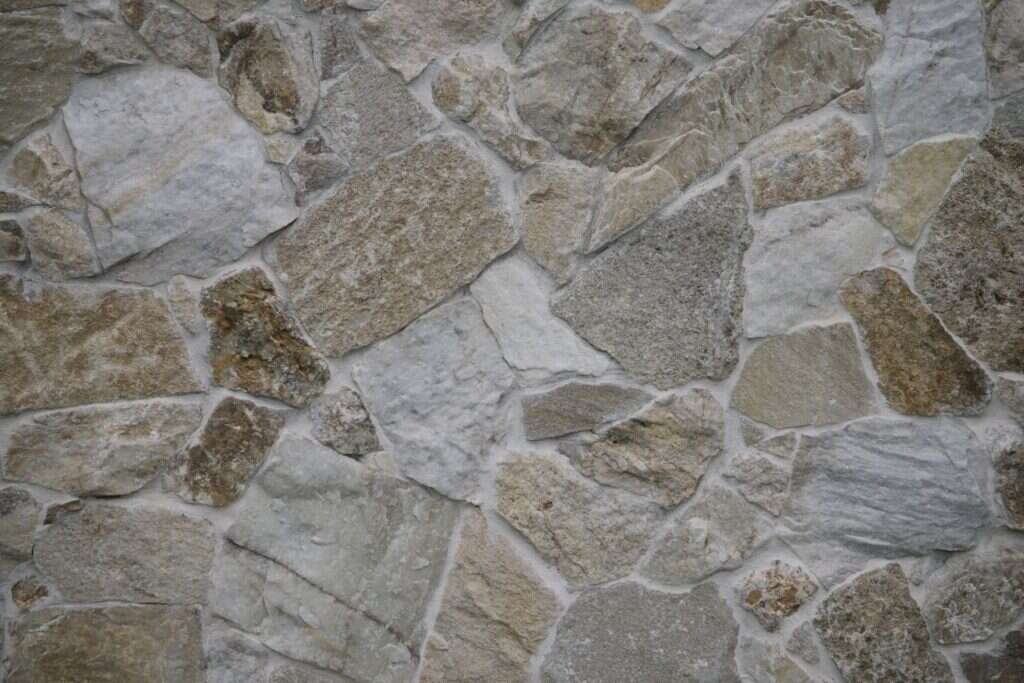 Textured natural stone wall with a random pattern