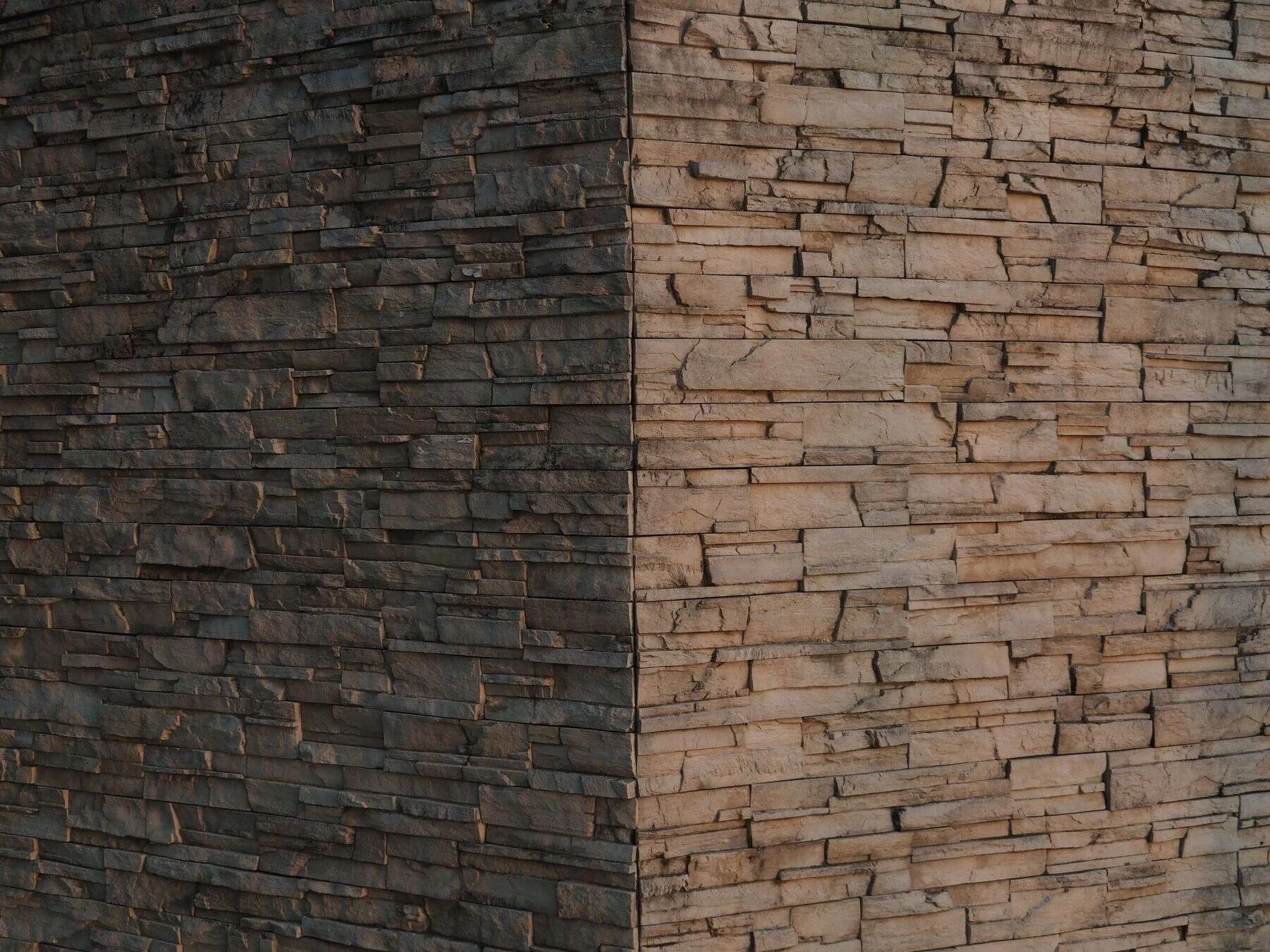 Natural stone cladding on a building corner in two colours