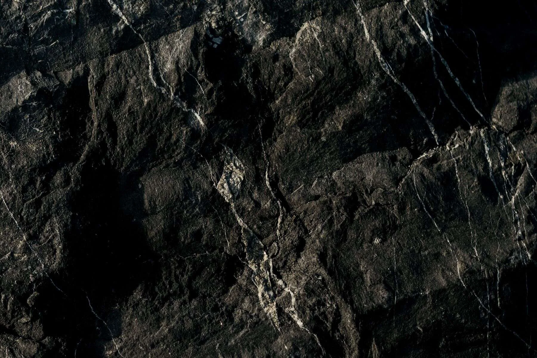 Dark textured natural stone surface