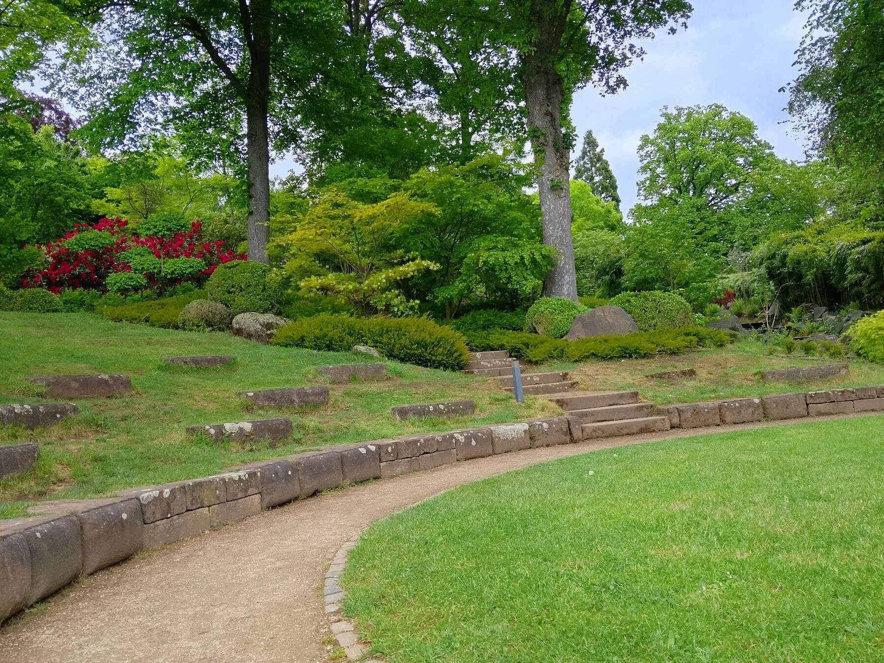 Curved stone pathway in a green park
