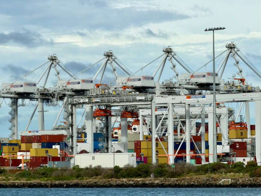 Container terminal with large cranes and stacked containers