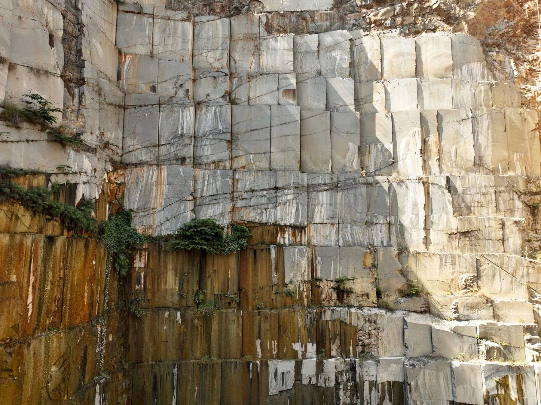 Massive granite quarry wall with natural rock faces