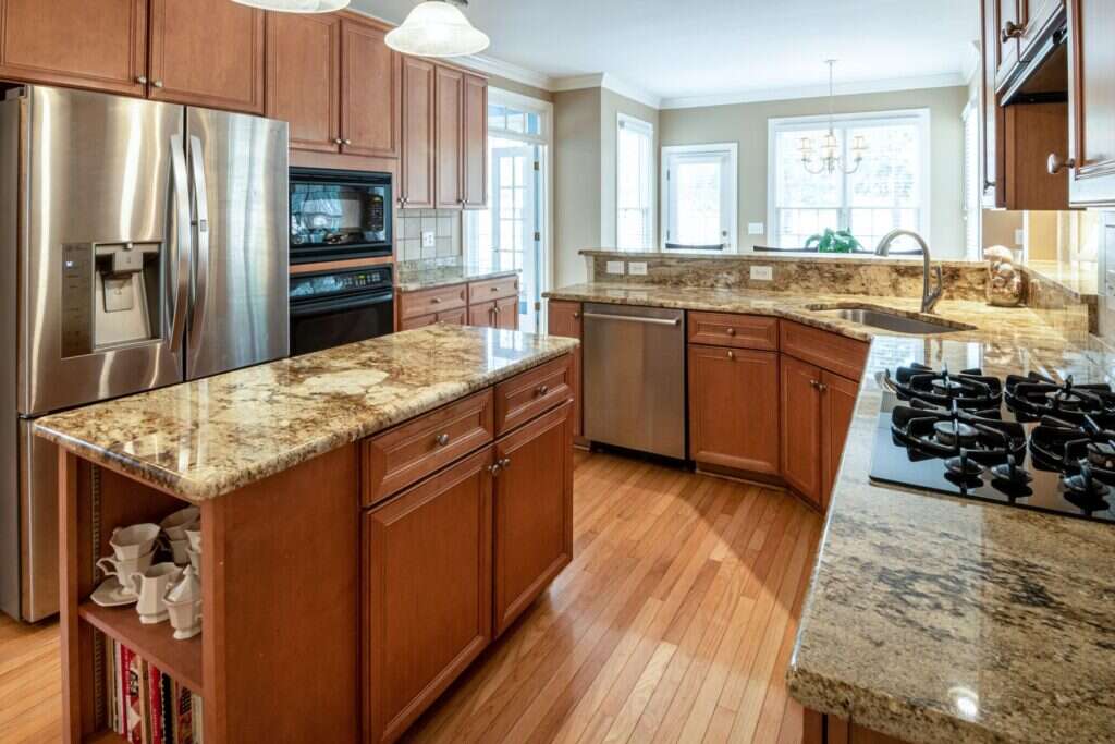 Golden granite kitchen island with a gas hob