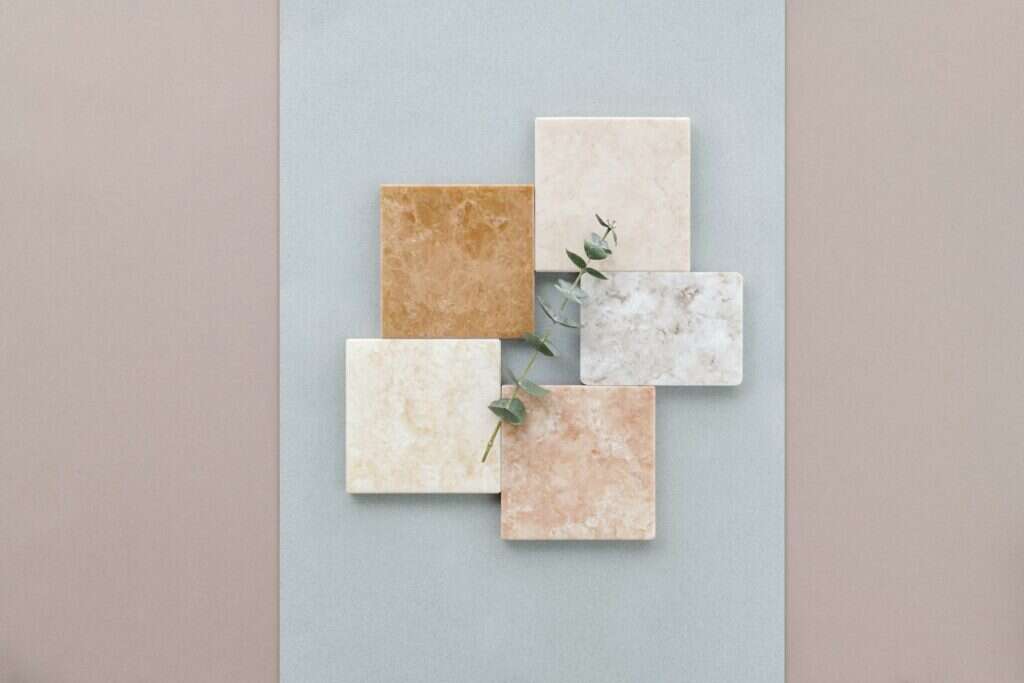 Natural stone tile samples in cream, orange and beige