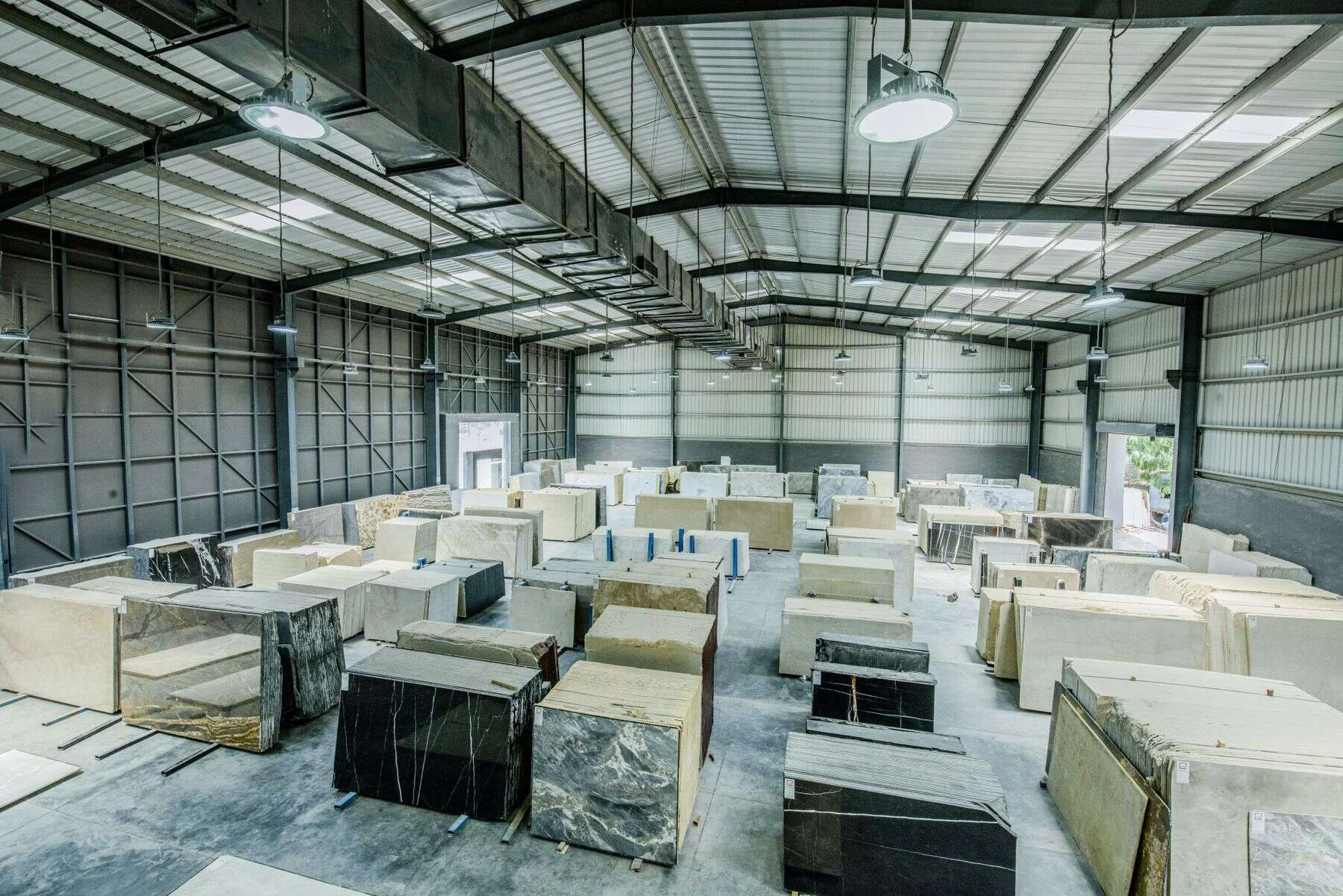Cut stone blocks stored inside a large warehouse