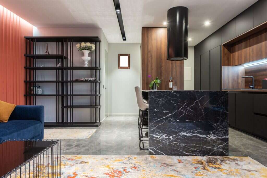 Black marble kitchen island in a modern interior