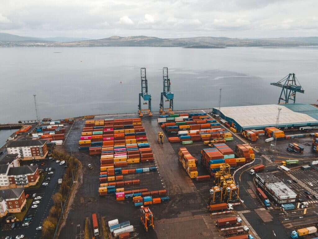 Aerial view of a container yard beside the sea