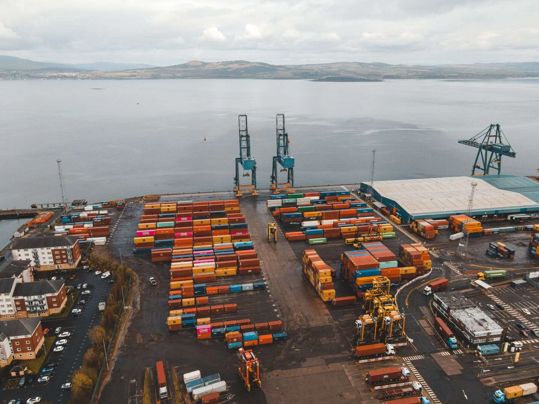 Aerial view of a container yard beside the sea