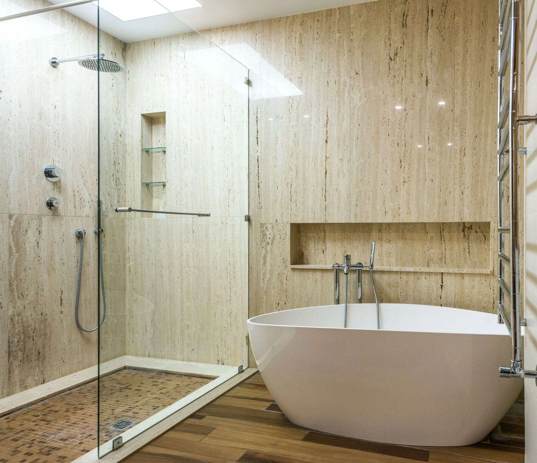 Travertine stone bathroom with a freestanding bath