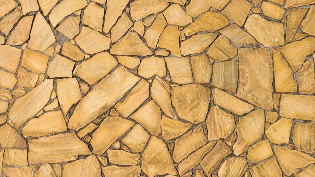 Yellow sandstone pieces laid as flooring