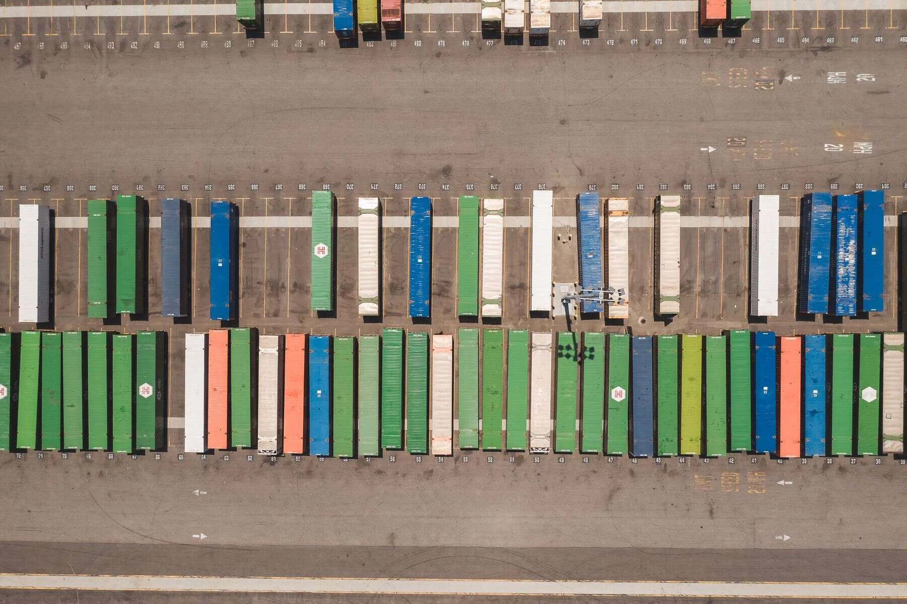Rows of colourful shipping containers seen from above