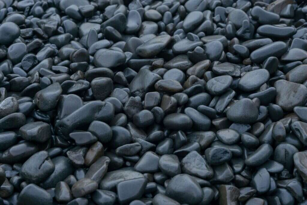 Smooth black and grey pebbles close-up
