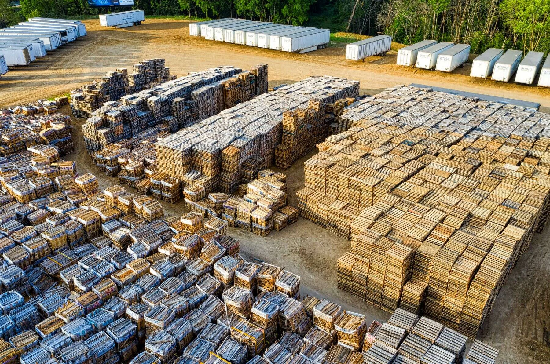 Aerial view of wooden pallets and planks in a storage yard